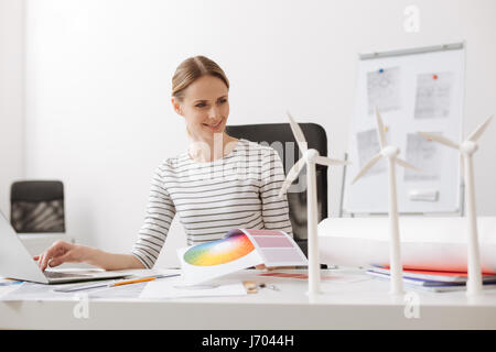 Positive female erchitect working in the office Stock Photo