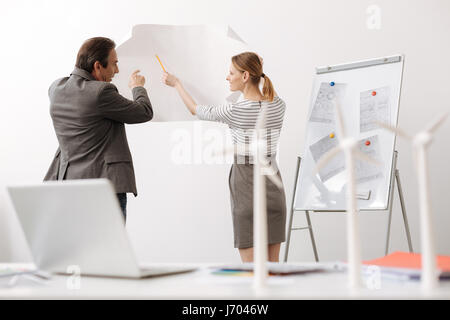 Professional engineers discussing wind turbine project Stock Photo