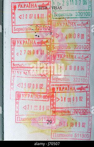 Passport page with Ukrainian entry and exit stamps closeup Stock Photo