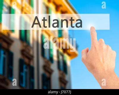 Atlanta - Hand pressing a button on blurred background concept ...
