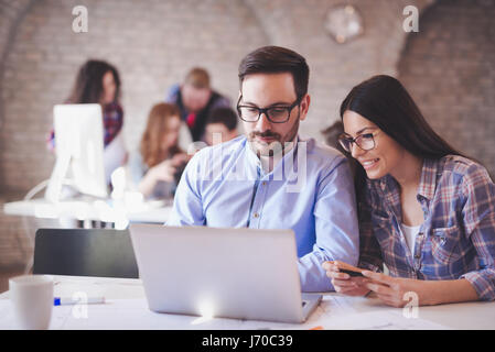 Programmers cooperating at information technology company Stock Photo