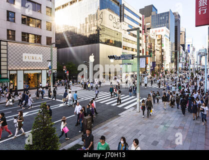 TOKYO - MAY 7, 2017: People wandering around the streets of Ginza, the luxurious shopping district in Tokyo, Japan capital city, where traffic is bann Stock Photo