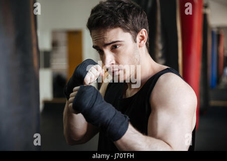 MMA fighter prepares to fight in ring, close-up legs in socks. Stock Photo
