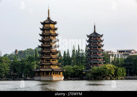 The Sun and Moon pagodas at Banyan lake in Guilin, China Stock Photo ...