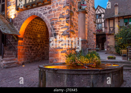 Evening at the medieval entry gate (La Porte Haute), Riquewihr, Alsace, Haut-Rhin, France Stock Photo