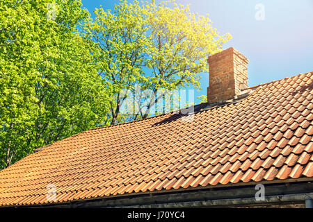 roof tile against blue sky on sunny day Stock Photo