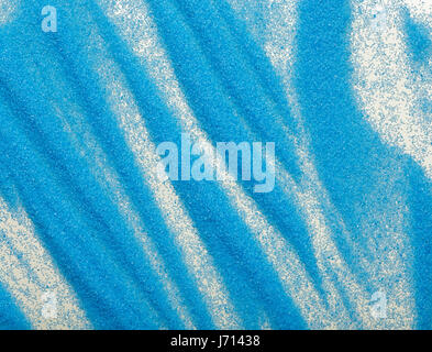An abstract background formed by strips of blue sand. Stock Photo