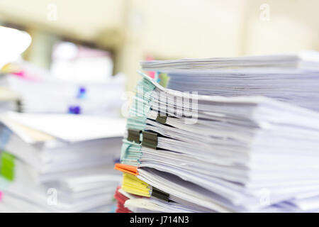 Pile of unfinished documents on office desk, Stack of business paper Stock Photo
