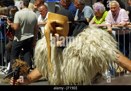 Sassari, Sardinia. Cavalcata Sarda 2017, traditional parade of costumes and riders from all over Sardinia. Boes and merdules, traditional mask of Otta Stock Photo