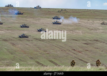 NATO military drill at Smardan shooting range in Romania  A Romanian TR-85 tank fires while the whole unit charge the enemy line during the NATO military drill 'Wind Spring -15' at Smardan shooting range, 260 kilometers north-east of Bucharest, Romania. Stock Photo