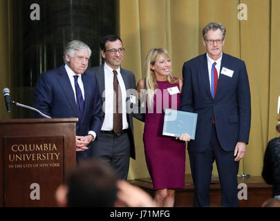 New York, USA. 23rd May, 2017. The New York Times' staff and Lee C. Bollinger (1st L), president of Columbia University, are seen on the stage during the 2017 Pulitzer Prize Award Ceremony in New York, the United States, on May 22, 2017. The New York Times' staff won the 2017 Pulitzer Prize for International Reporting for their work on Russian President Vladimir Putin's efforts to project Moscow's power abroad. Pulitzer Prize Administrator Mike Pride announced the winners of the 2017 Pulitzer Prizes in the World Room at Columbia University on April 10 in New York. Credit: Xinhua/Alamy Live New Stock Photo