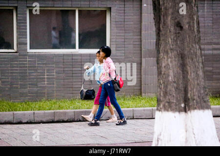 May 23, 2017 - Pyongyan, Pyongyan, China - Pyongyang, North Korea-August 2016: (EDITORIAL USE ONLY. CHINA OUT) Middle school students walking on street in Pyongyang. (Credit Image: © SIPA Asia via ZUMA Wire) Stock Photo