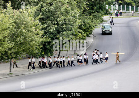 May 23, 2017 - Pyongyan, Pyongyan, China - Pyongyang, North Korea-August 2016: (EDITORIAL USE ONLY. CHINA OUT) Middle school students walking on street in Pyongyang. (Credit Image: © SIPA Asia via ZUMA Wire) Stock Photo