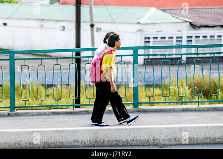 May 23, 2017 - Pyongyan, Pyongyan, China - Pyongyang, North Korea-August 2016: (EDITORIAL USE ONLY. CHINA OUT) Middle school students walking on street in Pyongyang. (Credit Image: © SIPA Asia via ZUMA Wire) Stock Photo