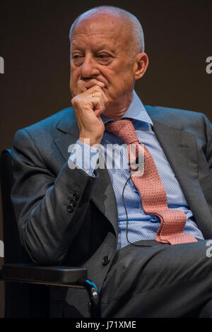 The curator of the exhibition, Lord Norman Foster, poses with a car at ...