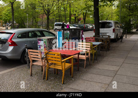 Berlin, April 26th: Coffee terrace with color chairs in the Wrangelkiez, near Gorlitzer (Goerlitzer) Park in Berlin Kreuzberg on April 26th 2017. Stock Photo