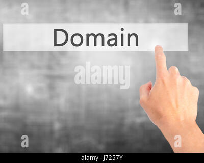 Domain - Hand pressing a button on blurred background concept . Business, technology, internet concept. Stock Photo Stock Photo
