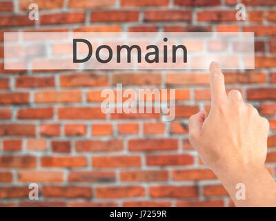 Domain - Hand pressing a button on blurred background concept . Business, technology, internet concept. Stock Photo Stock Photo
