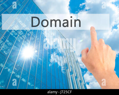 Domain - Hand pressing a button on blurred background concept . Business, technology, internet concept. Stock Photo Stock Photo
