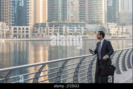 Businessman in Dubai Marina, UAE Stock Photo