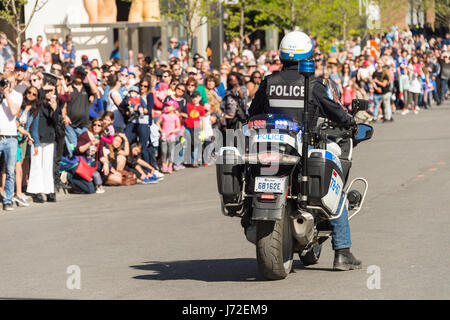 Montreal, CA - 20 May 2017: Police Officer on motorbike during Royal de Luxe Show Stock Photo