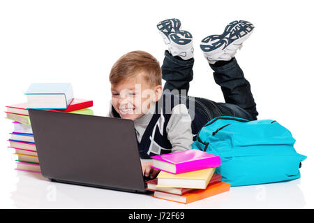 Boy with laptop and books Stock Photo