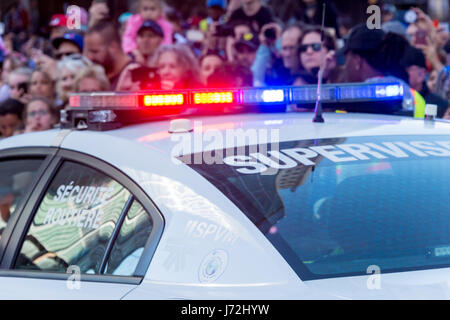 Montreal, CA - 19 May 2017: Flashing lights of a police car in Montreal with out of focus people in background Stock Photo