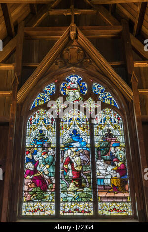 Wellington, New Zealand - March 10, 2017: Inside the wooden Old Saint Paul church shows large elaborate stained glass window in South Alcove depicting Stock Photo