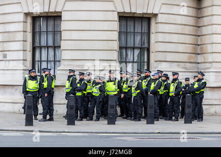 London, UK - 1st April, 2017: Police stand guard on Whitehall street during a protest against Islamists, ISIS. Police were on standby. Stock Photo