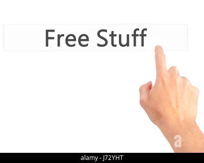Free Stuff - Hand pressing a button on blurred background concept ...