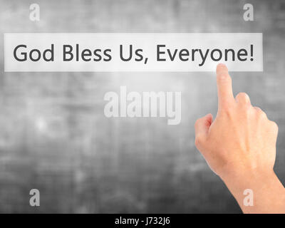 God Bless Us, Everyone - Hand pressing a button on blurred background concept . Business, technology, internet concept. Stock Photo Stock Photo