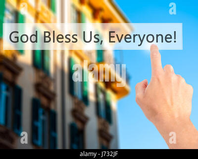 God Bless Us, Everyone - Hand pressing a button on blurred background concept . Business, technology, internet concept. Stock Photo Stock Photo