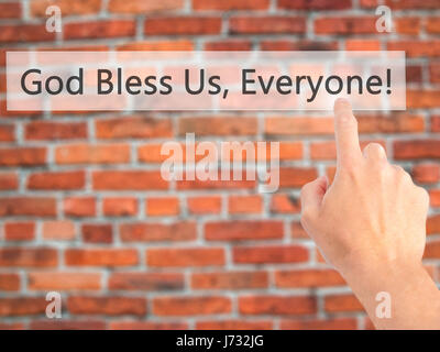 God Bless Us, Everyone - Hand pressing a button on blurred background concept . Business, technology, internet concept. Stock Photo Stock Photo