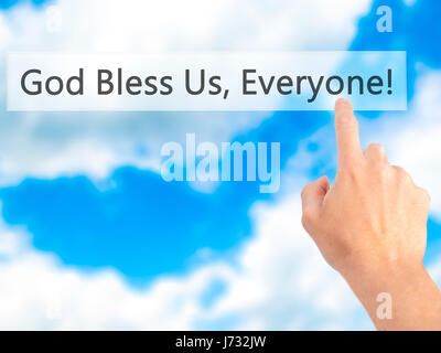 God Bless Us, Everyone - Hand pressing a button on blurred background concept . Business, technology, internet concept. Stock Photo Stock Photo