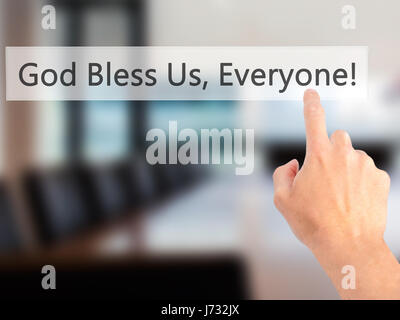 God Bless Us, Everyone - Hand pressing a button on blurred background concept . Business, technology, internet concept. Stock Photo Stock Photo