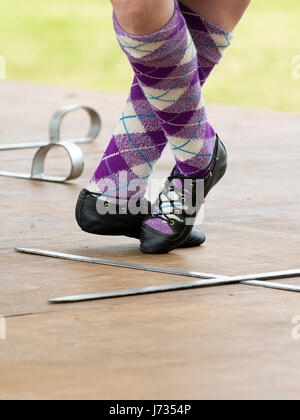 Fochabers, Scotland - May 21, 2017: Feet of a Highland Dancer performing a traditional Sword Dance at a Highland Games event. Stock Photo