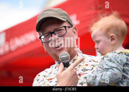 Paul Hill, Green Party candidate for Rayleigh & Wickford for the 2017 general election, holding his baby during a speech Stock Photo