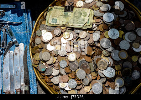 Lots of cash money in coins Stock Photo