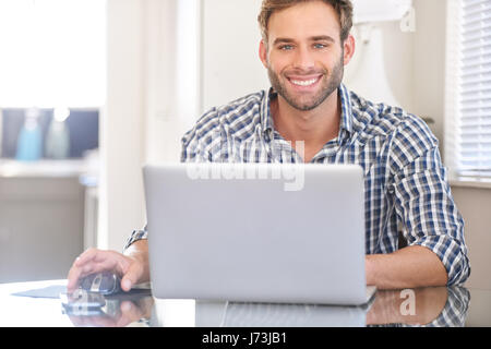 bright cropped image of handsome young man smiling at camera Stock Photo