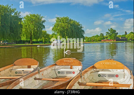 White rowing boats moored on the River Avon in Stratford upon Avon, Warwickshire. Stock Photo