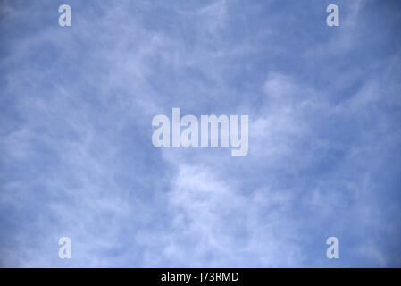 blue sky cirrus clouds white and stringy Stock Photo