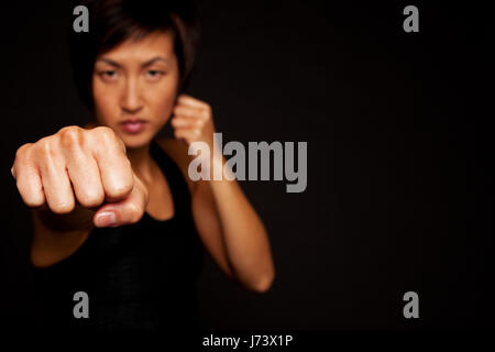 Portrait of woman practicing self defense. Stock Photo