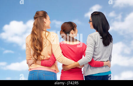 international happy women from back hugging Stock Photo
