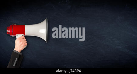 empty wide slate blackboard chalkboard with hand holding megaphone business blank background Stock Photo