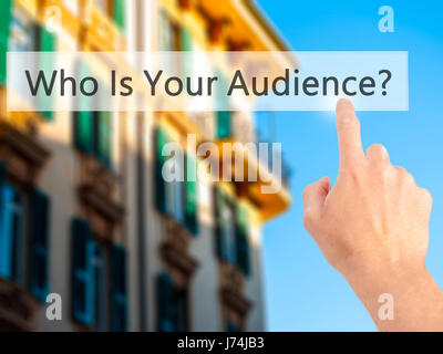 Who Is Your Audience? - Hand pressing a button on blurred background concept . Business, technology, internet concept. Stock Photo Stock Photo