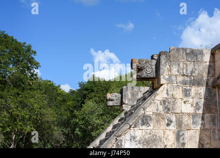 stone jaguar head statue at the Platform of the Eagles and Jaguars in Mayan Ruins of Chichen Itza, Mexico Stock Photo