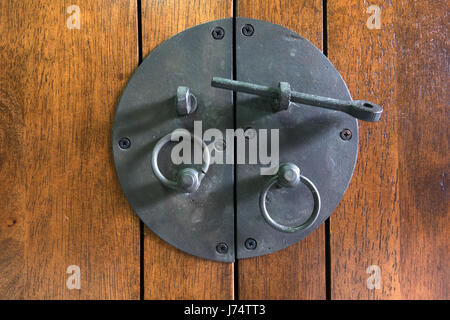 Close up - Vintage black Latch on wood cupboard Stock Photo