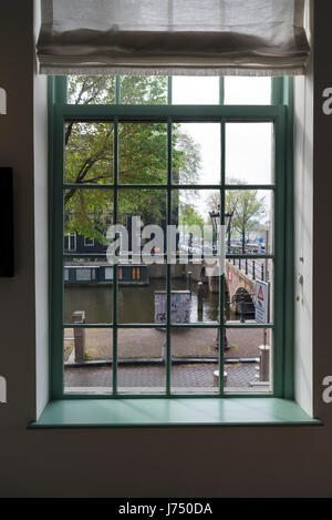 AMSTERDAM, NETHERLANDS - MAY, 13, 2017: View of the city of Amsterdam through a window Stock Photo