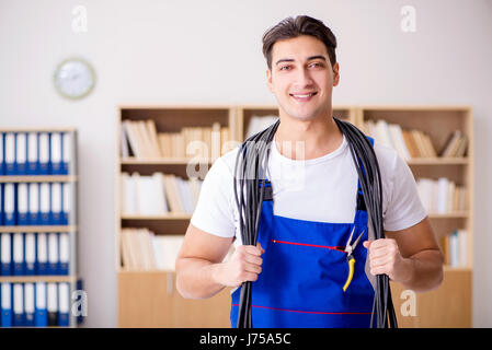 Man doing electrical repairs at home Stock Photo
