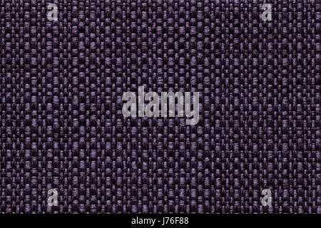 Dark violet background with checkered pattern, closeup. Structure of the purple fabric macro. Stock Photo